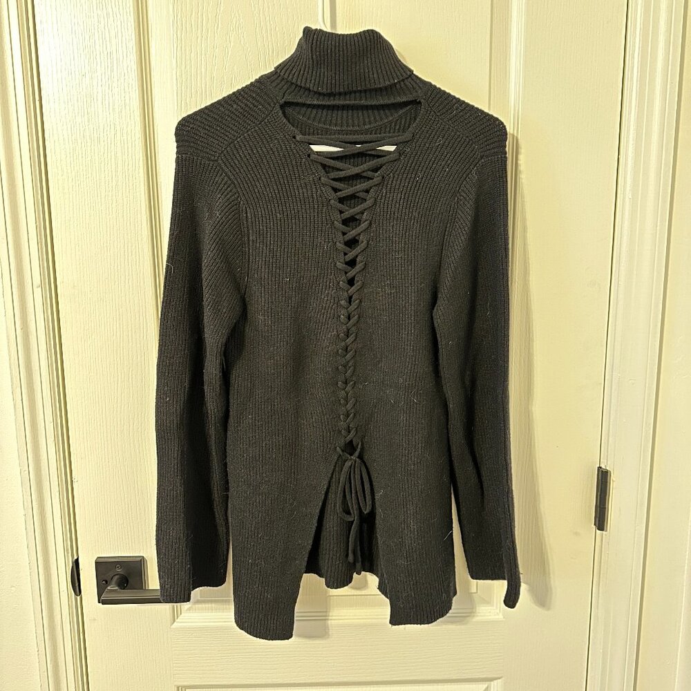 Black turtleneck tie-back sweater